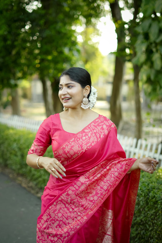 Smiling woman in pink saree with zari workSmiling woman in pink saree with Gala Border pattern