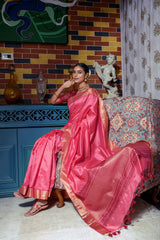Pink saree with zari work and gold border sitting