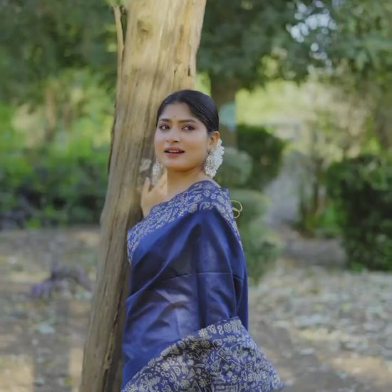 Navy blue saree with intricate Gala Border pattern closeup in forest