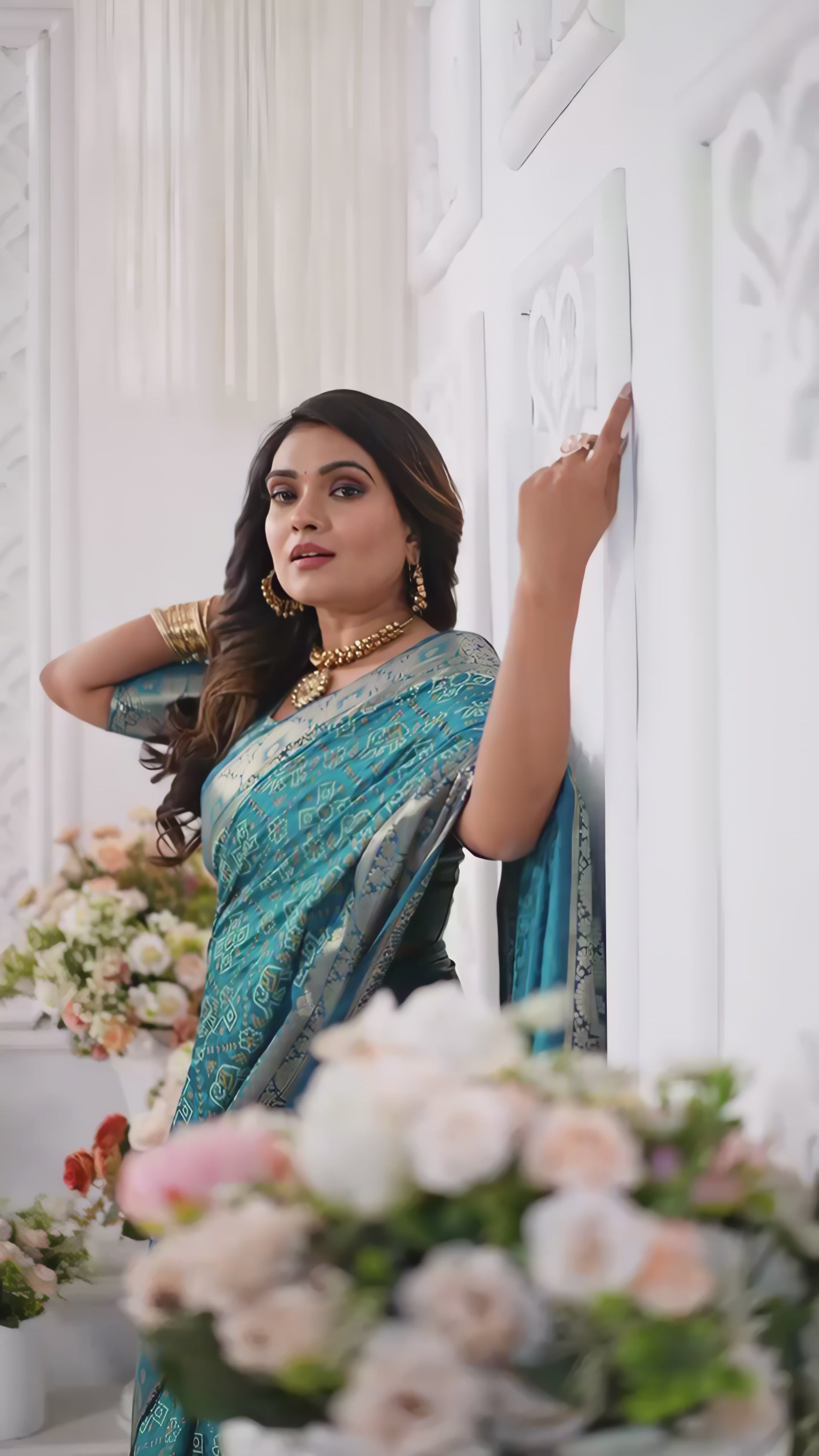 teal-silk-saree-silver-border-floral-white-room