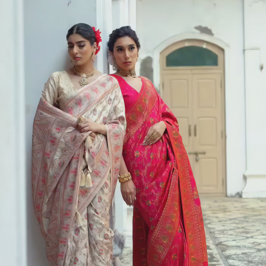 woman-cream-floral-silk-saree-pink-border-traditional-jewelry-heritage-background