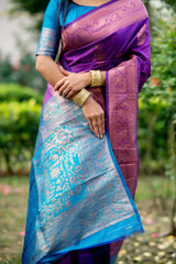 Purple saree with intricate zari work and blue border