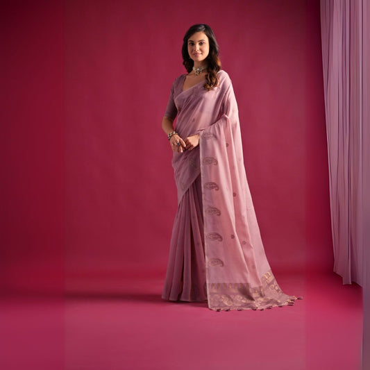 Woman wearing soft pink Resham weaving saree posing outdoors in traditional Indian ethnic attire