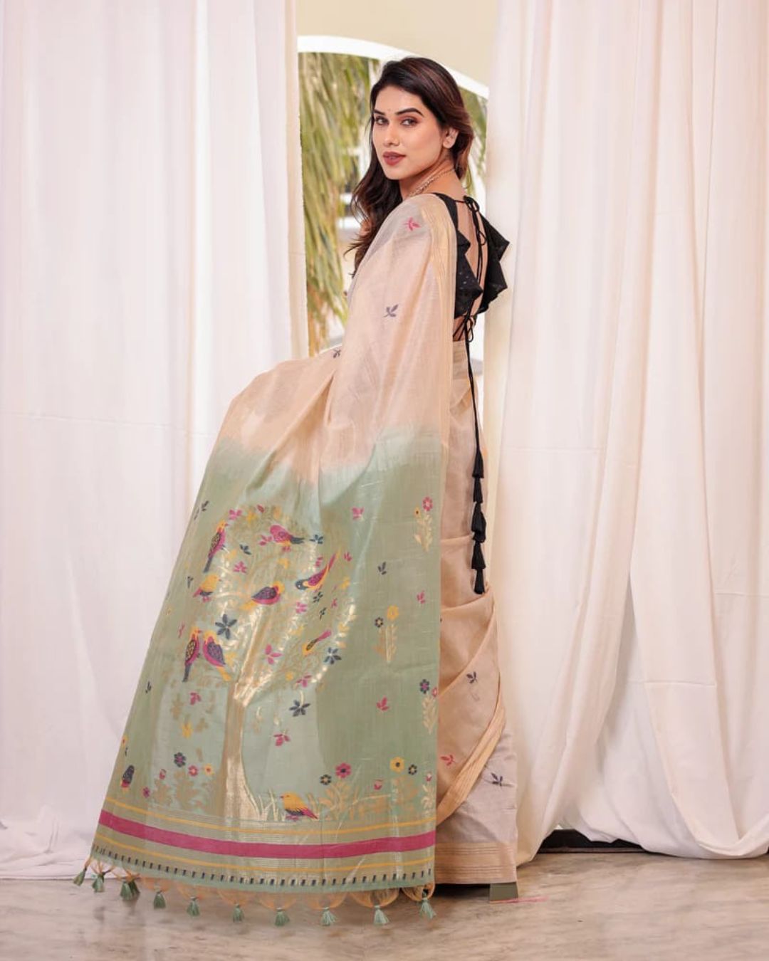 Elegant soft pastel green saree featuring detailed resham and zari weaving work