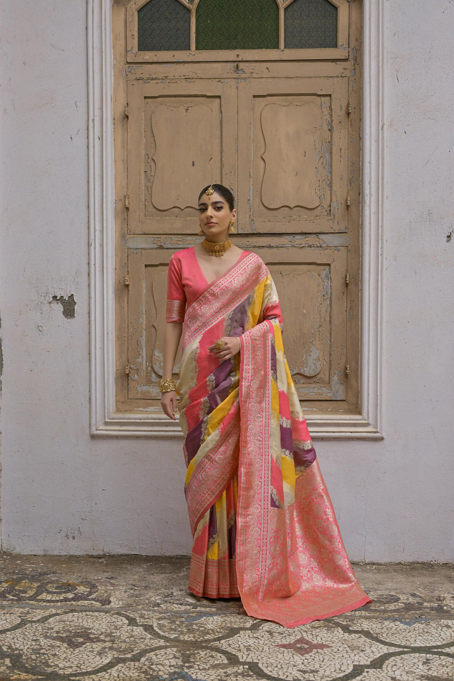 Yellow saree with Kadwa style weaving and multicolor stripes