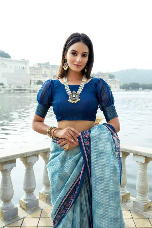 Powder blue zari work soft pashmina silk saree showcasing intricate craftsmanship and elegant